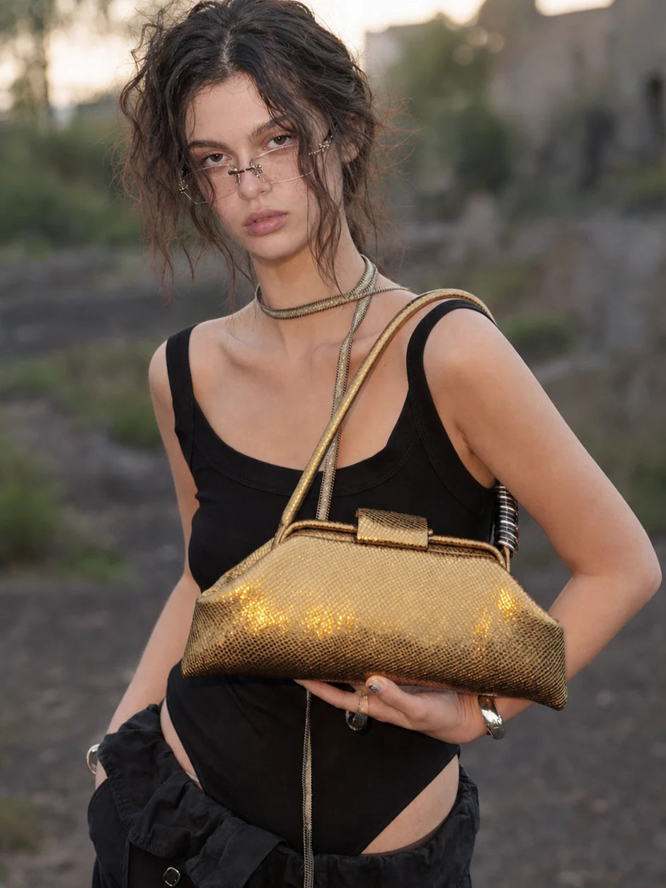 The Ring Baguette · Gold Snake
