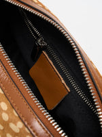 Close-up of interior zip pocket and black fabric lining