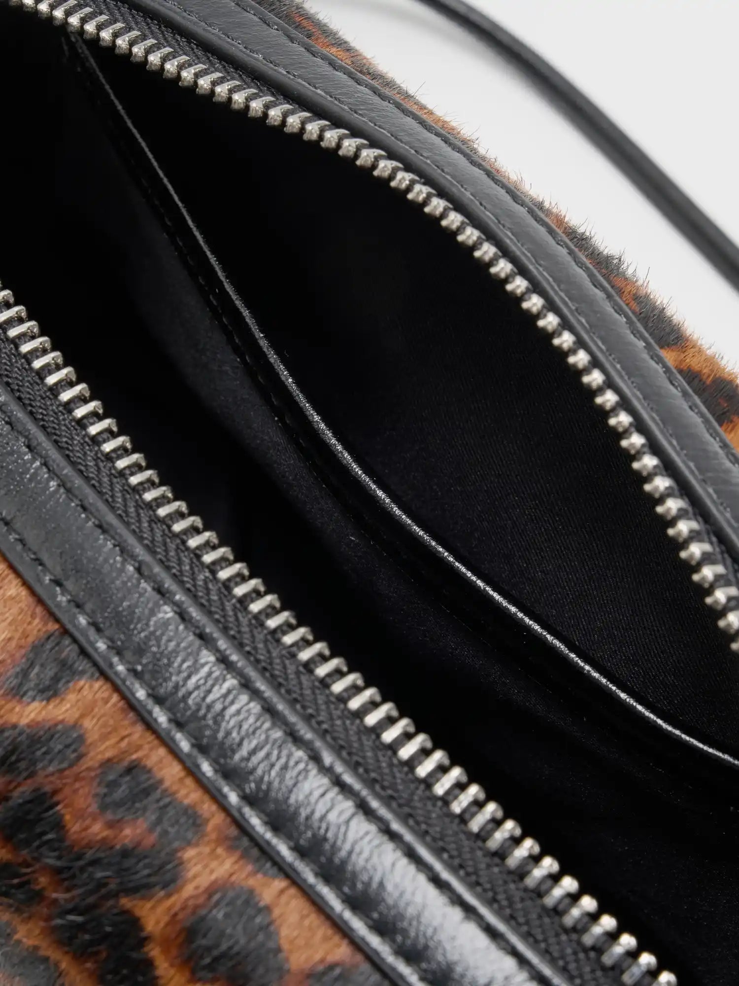 Close-up of black fabric interior and slip pocket
