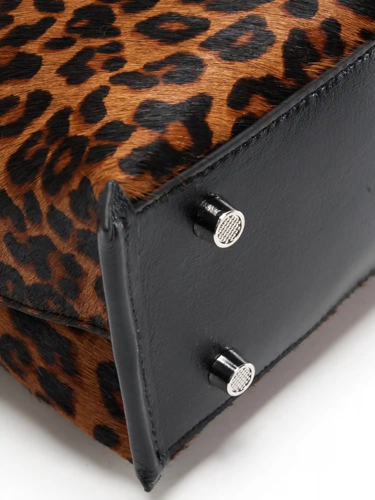 Black top-grain cowhide base and metal feet