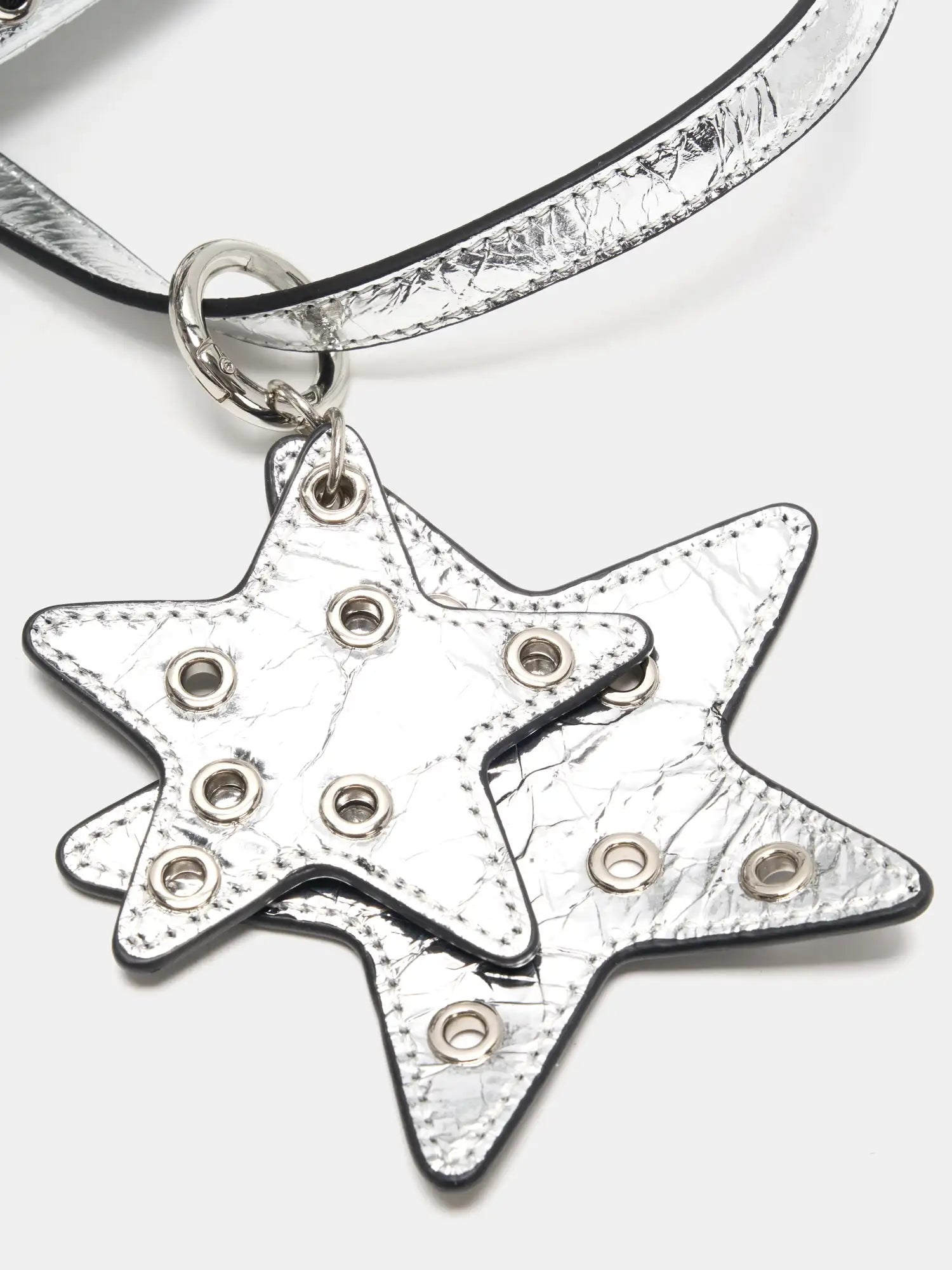 Layered metallic star charms with hollow grommets