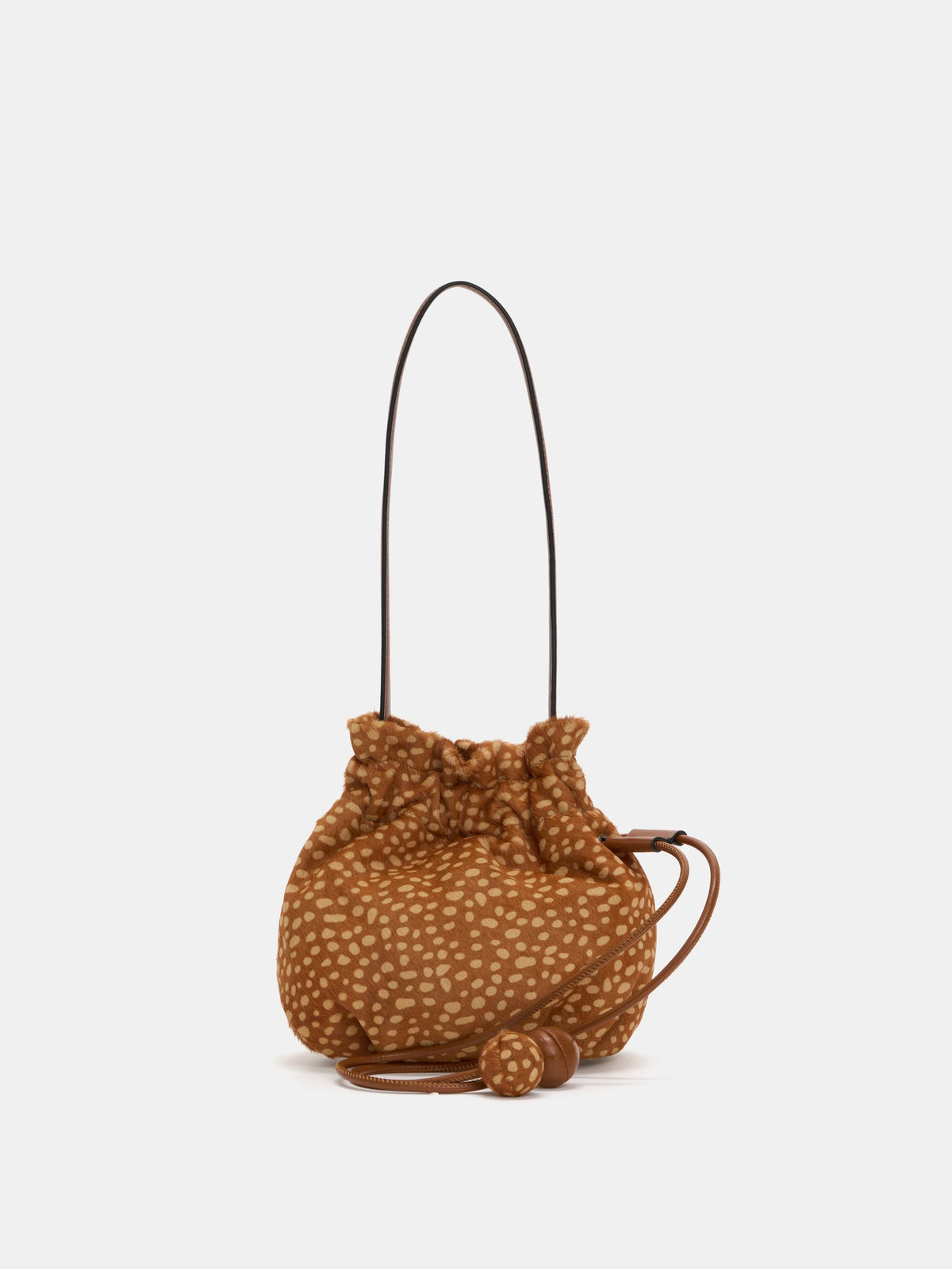 Fawn-spotted rounded drawstring shoulder bag with brown strap and two spherical cord ends