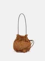 Fawn-spotted rounded drawstring shoulder bag with brown strap and two spherical cord ends