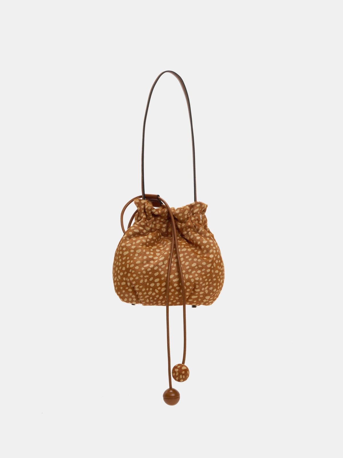 Fawn-spotted bag suspended by the shoulder strap with long drawstring ends hanging below