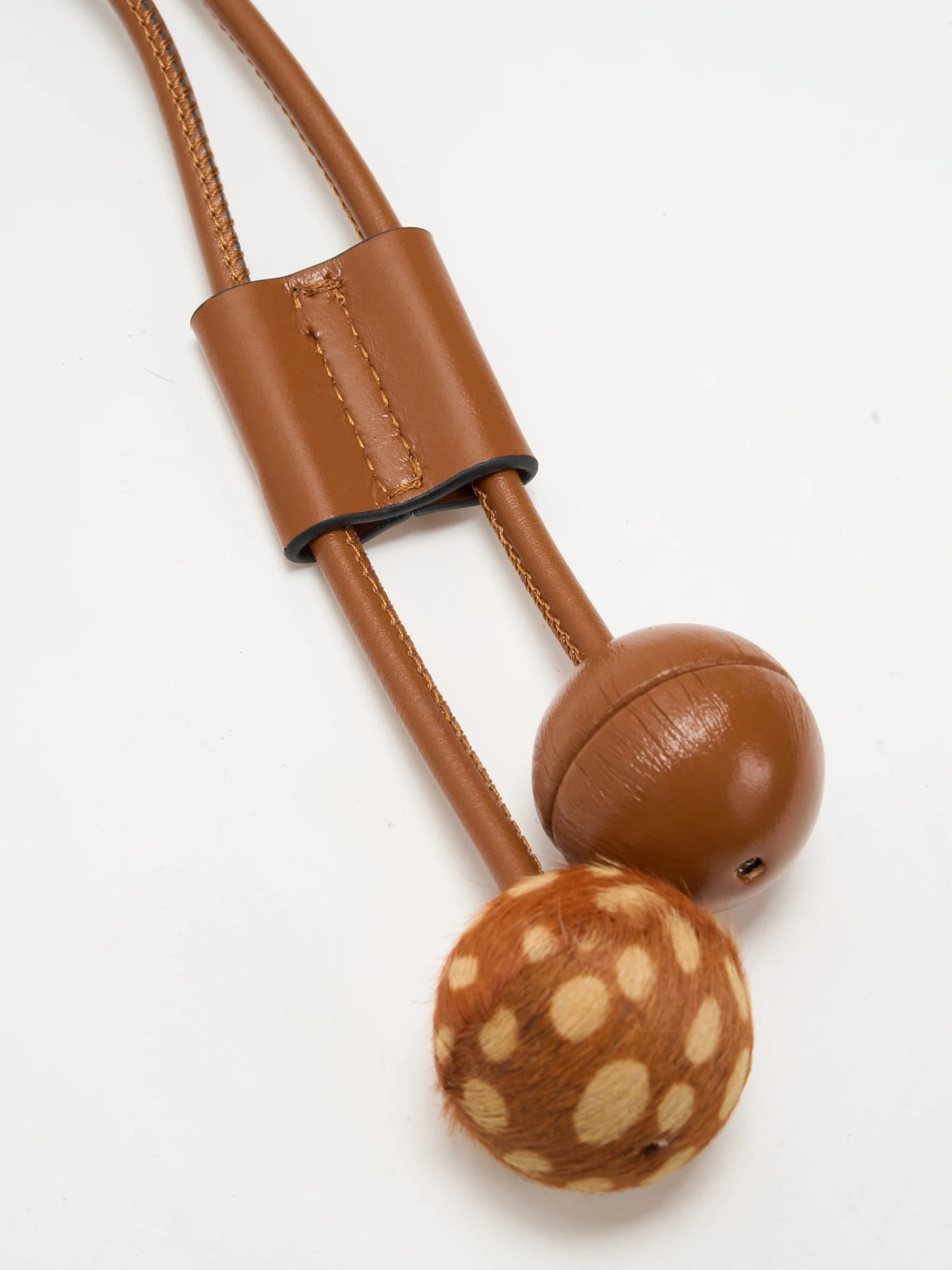 twin bobble details detail of The Bobble Drawstring Shoulder Bag - Fawn Dapple