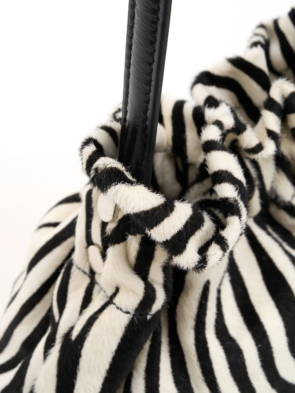 sculpted gathers detail of The Bobble Drawstring Shoulder Bag - Ivory Zebra