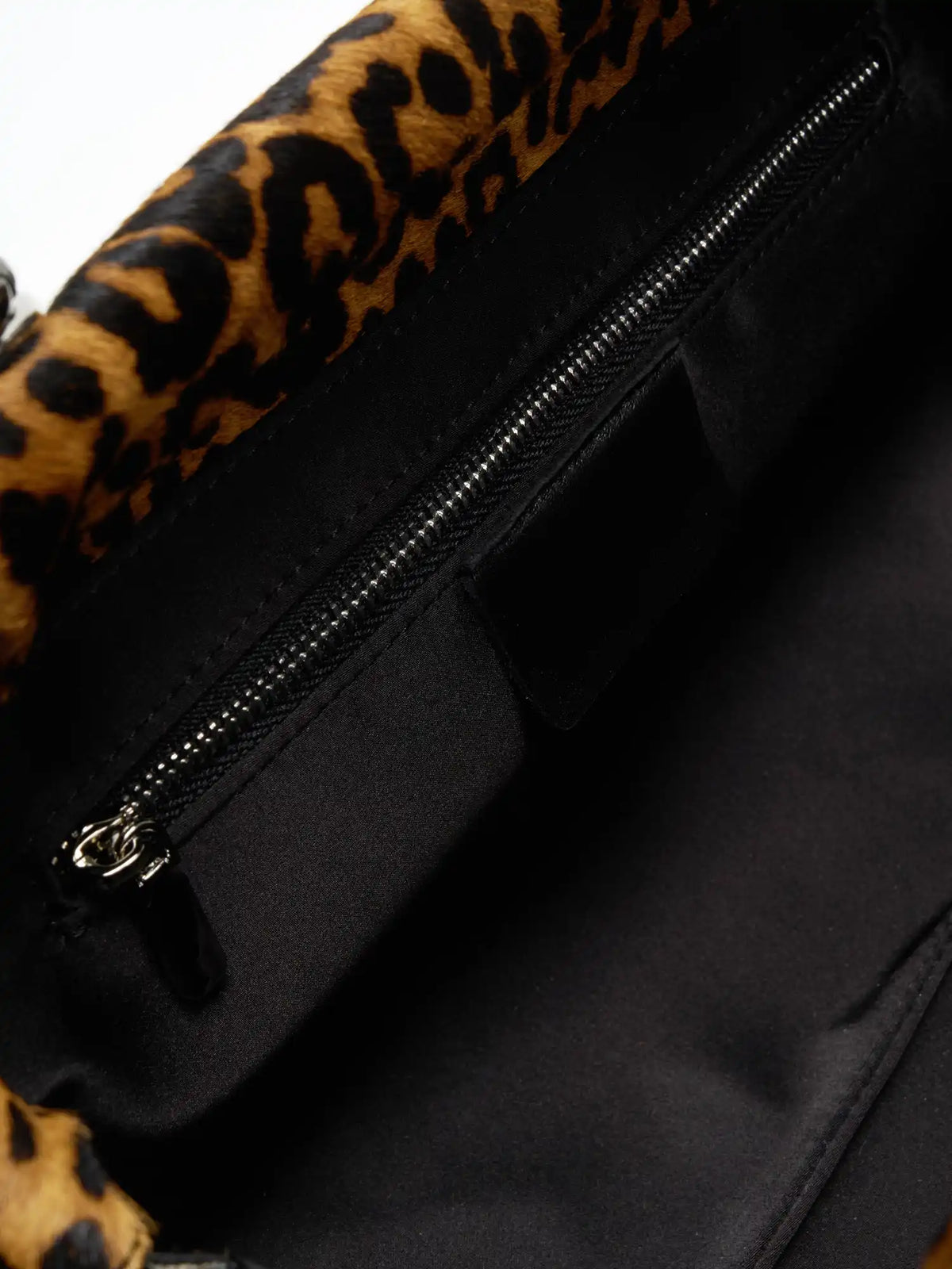 Interior zip pocket inside the leopard hair-on shoulder bag