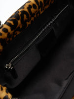 Interior zip pocket inside the leopard hair-on shoulder bag