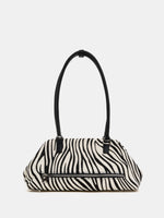 Large zebra frame shoulder bag rear view with exterior zip pocket