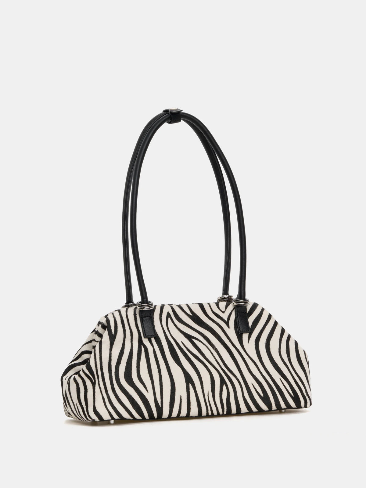 Zebra hair-on frame bag three-quarter front view with long handles