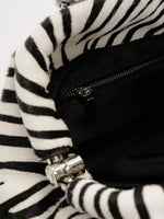 Interior zip pocket inside the zebra hair-on shoulder bag