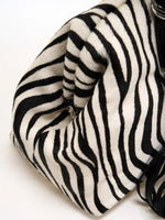 Sculpted side fold on the zebra hair-on frame bag
