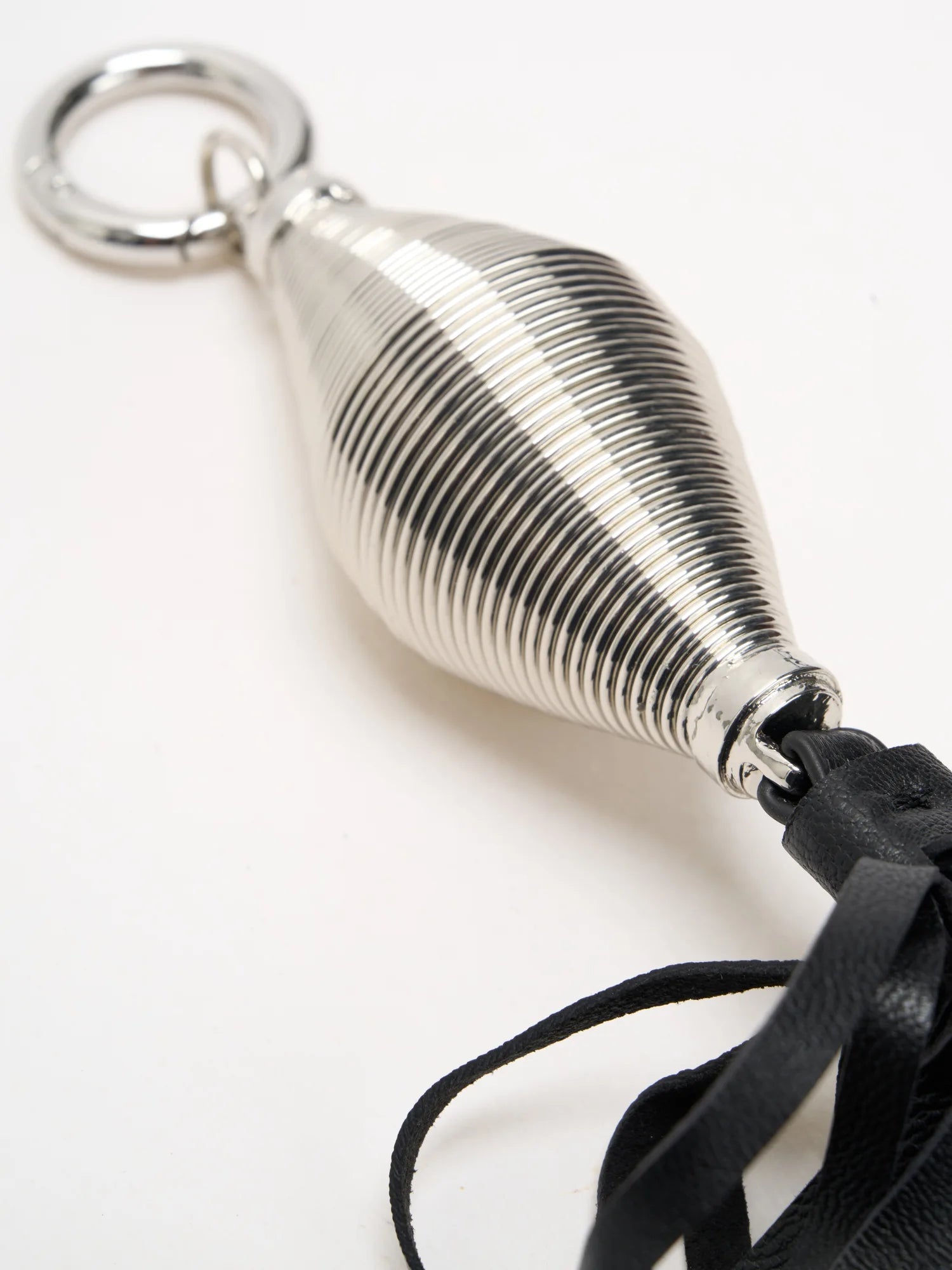Sculpted silver tassel detail