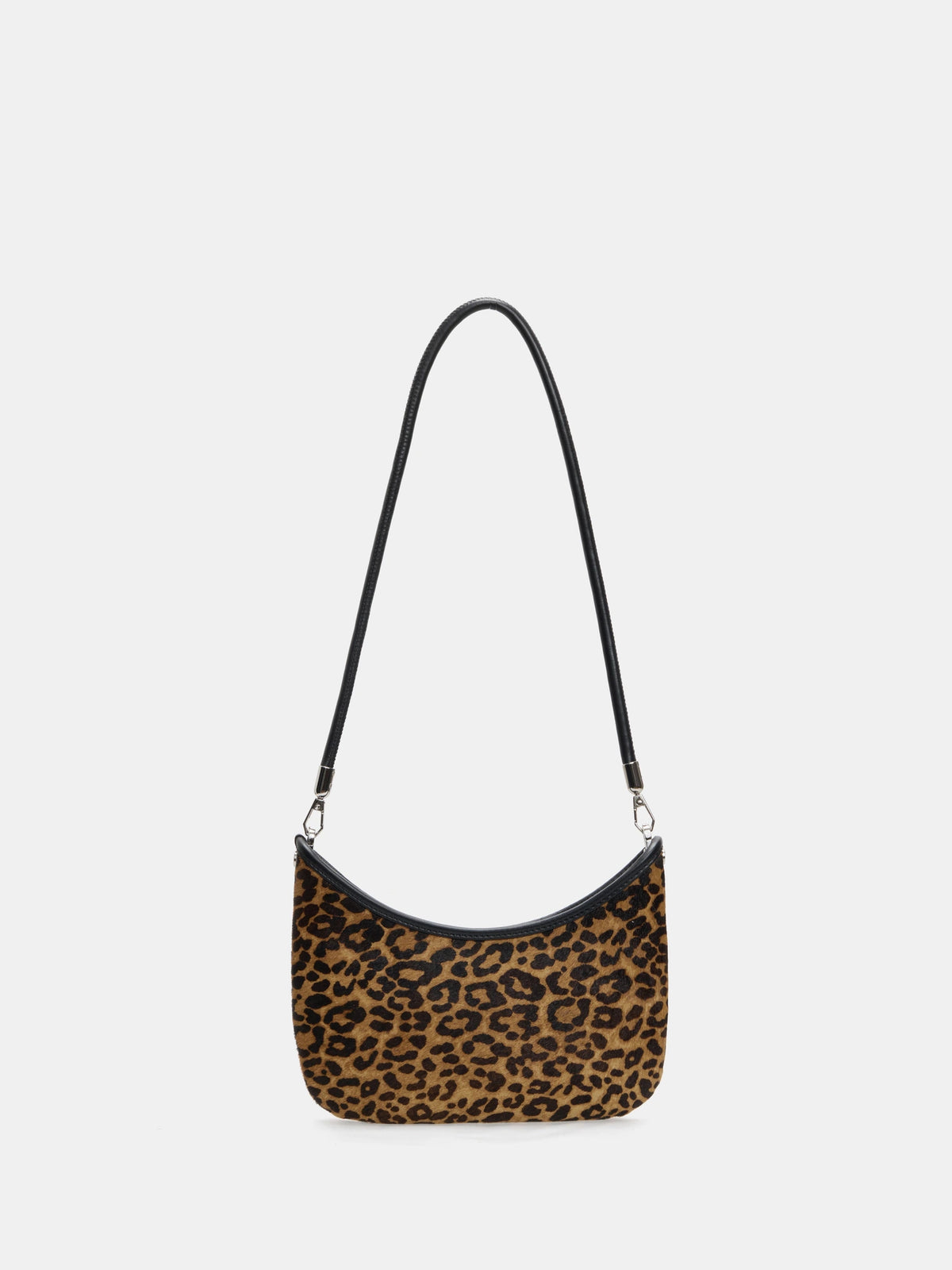 Front view of a leopard hair-on hide crescent bag with black trim and a short shoulder strap