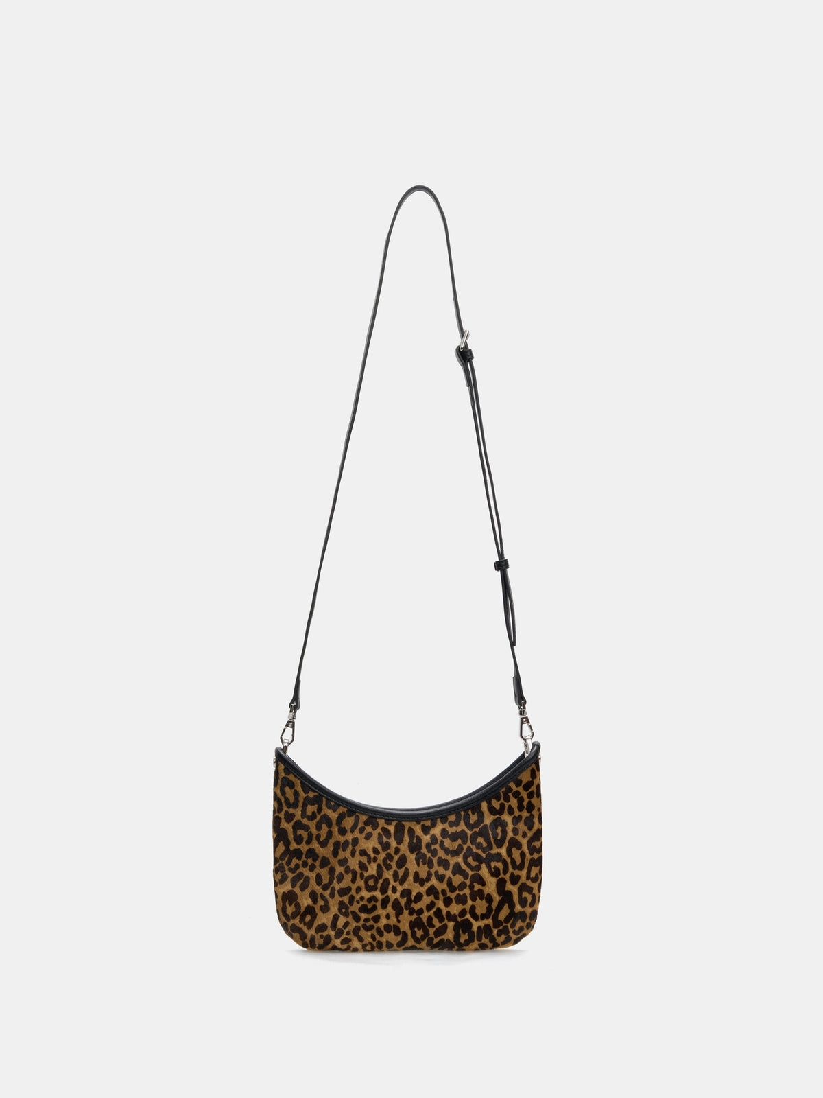 Leopard crescent bag shown with the adjustable long black strap attached