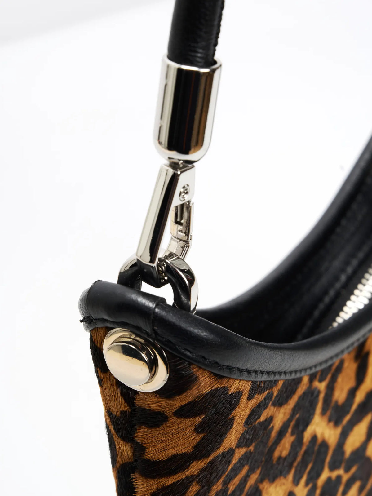 polished connections detail of The Arc Crescent Bag - Leopard