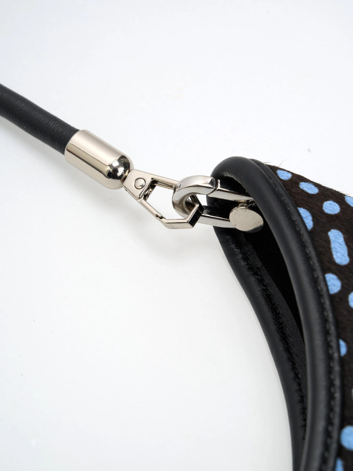 polished connections detail of The Arc Crescent Bag - Blue Dots