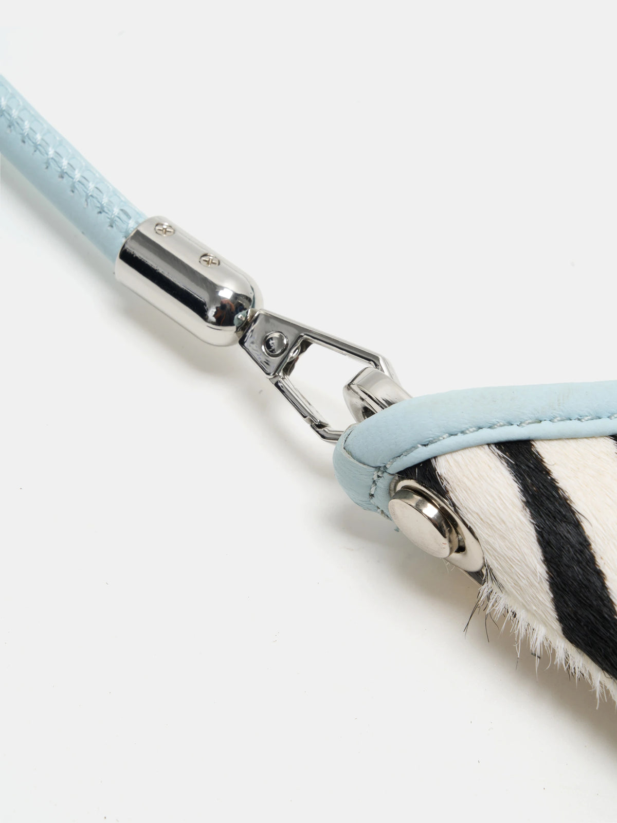 ice-blue connections detail of The Arc Crescent Bag - Ice Zebra