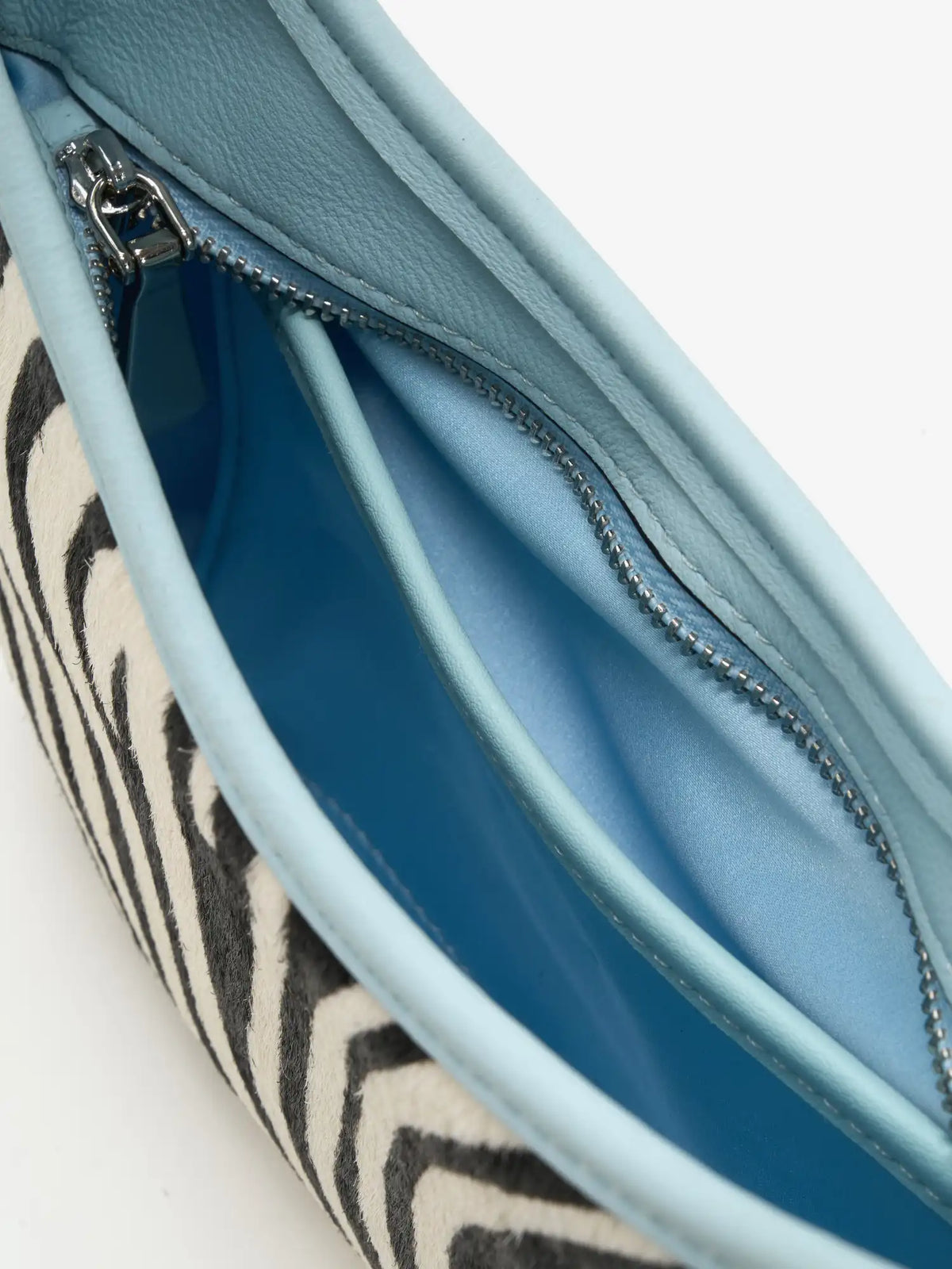 pockets with purpose detail of The Arc Crescent Bag - Ice Zebra