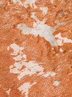 Close-up of caramel hair-on texture with ivory and silvery patches