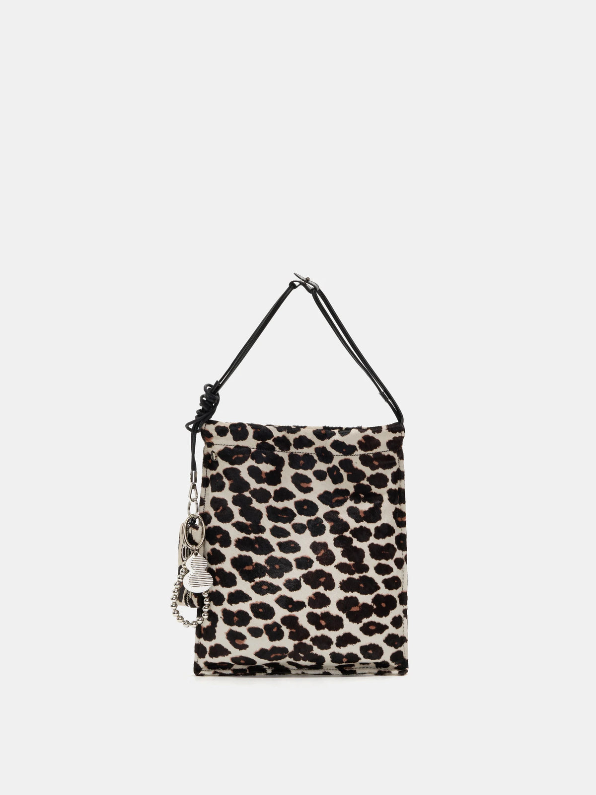 Front view of Light Beige Leopard hair-on bucket bag with short handles and hanging accessories