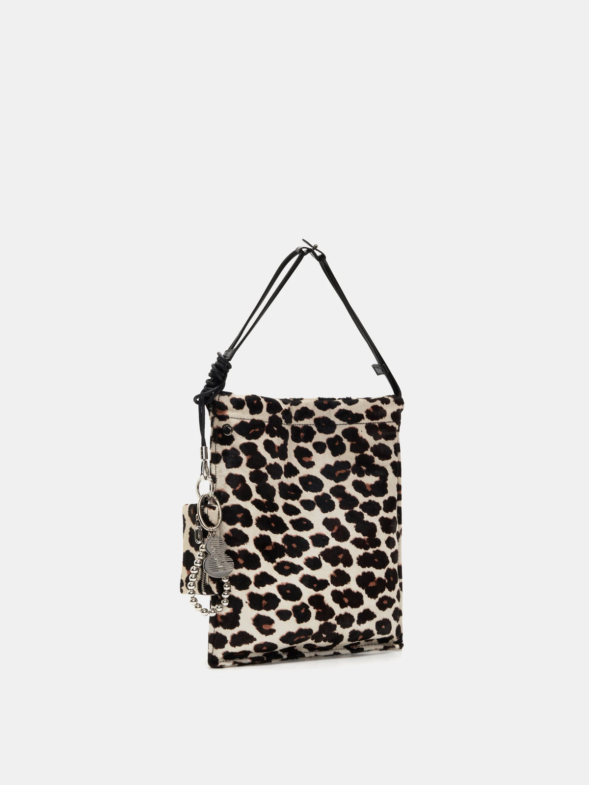 Angled view of Light Beige Leopard bucket bag showing the flat silhouette and matching pouch