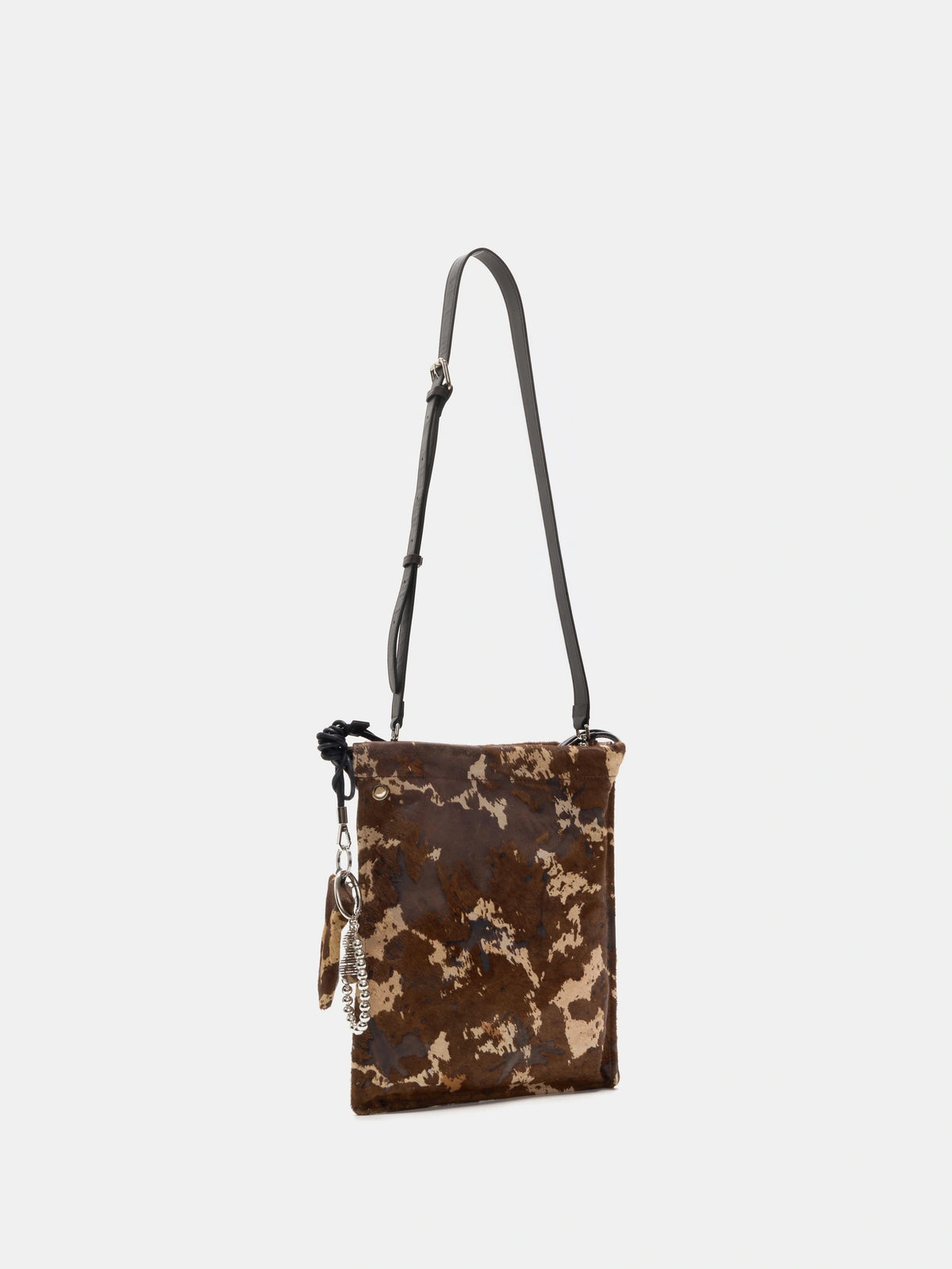 Mocha Cow Print bucket bag with adjustable dark brown leather long strap attached