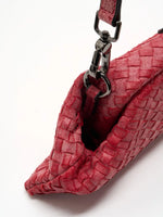 Vintage Rose Weave cowhide chain baguette bag close-up of the detachable leather strap clip and side ring