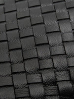 Black Weave handwoven sheepskin chain baguette bag close-up of the handwoven sheepskin strips