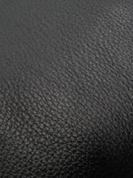 Pebbled Black cowhide chain baguette bag close-up of the fine pebbled cowhide texture