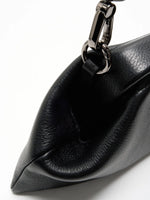 Pebbled Black cowhide chain baguette bag close-up of the folded side and detachable leather strap clip