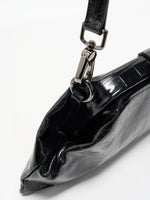 Black Croc cowhide chain baguette bag close-up of the detachable leather strap clip and folded side