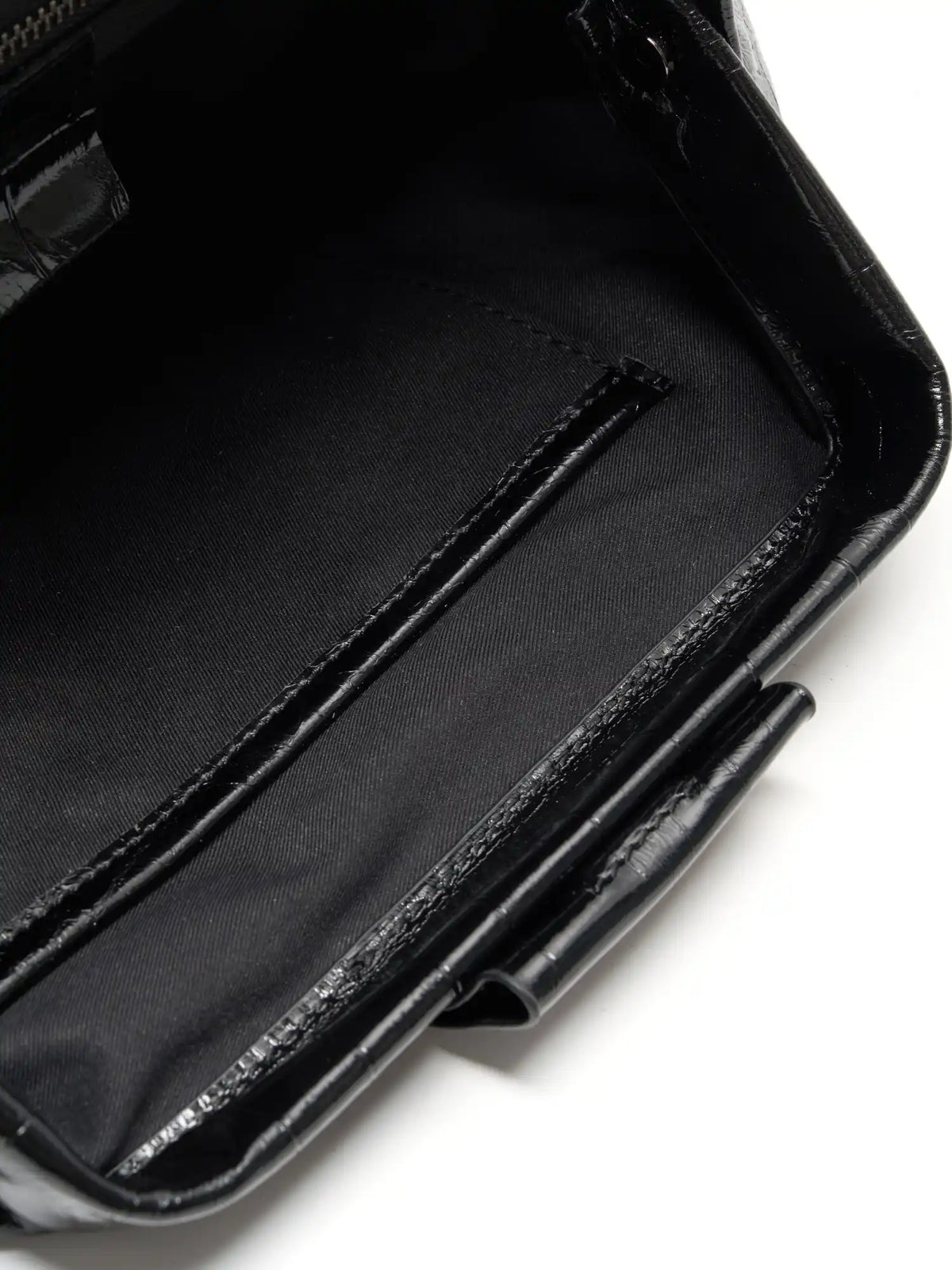 Black Croc cowhide chain baguette bag close-up of the interior slip pocket and fabric lining
