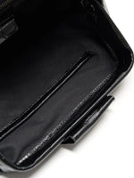Black Croc cowhide chain baguette bag close-up of the interior slip pocket and fabric lining