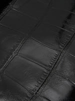 Black Croc cowhide chain baguette bag close-up of the glossy large-scale croc pattern
